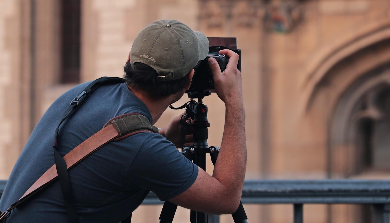Generic photographer with a telephoto lens on deck of a small expedition vessel